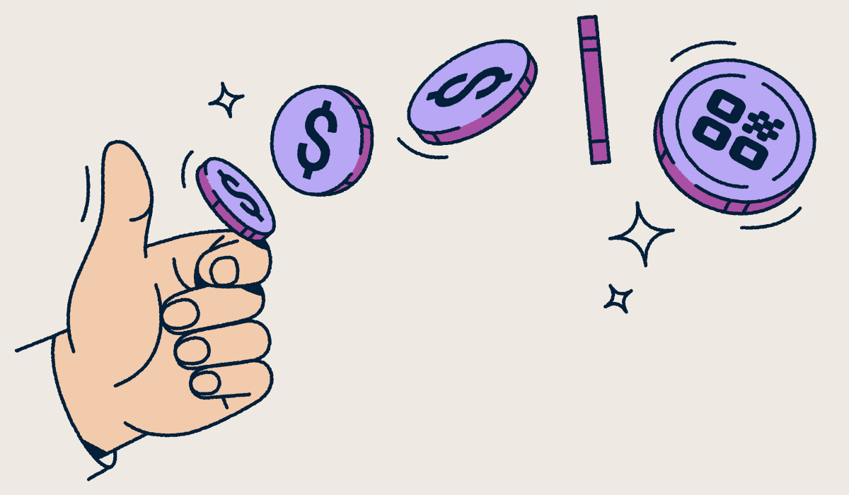 A hand flipping a coin with a QR Code on it.